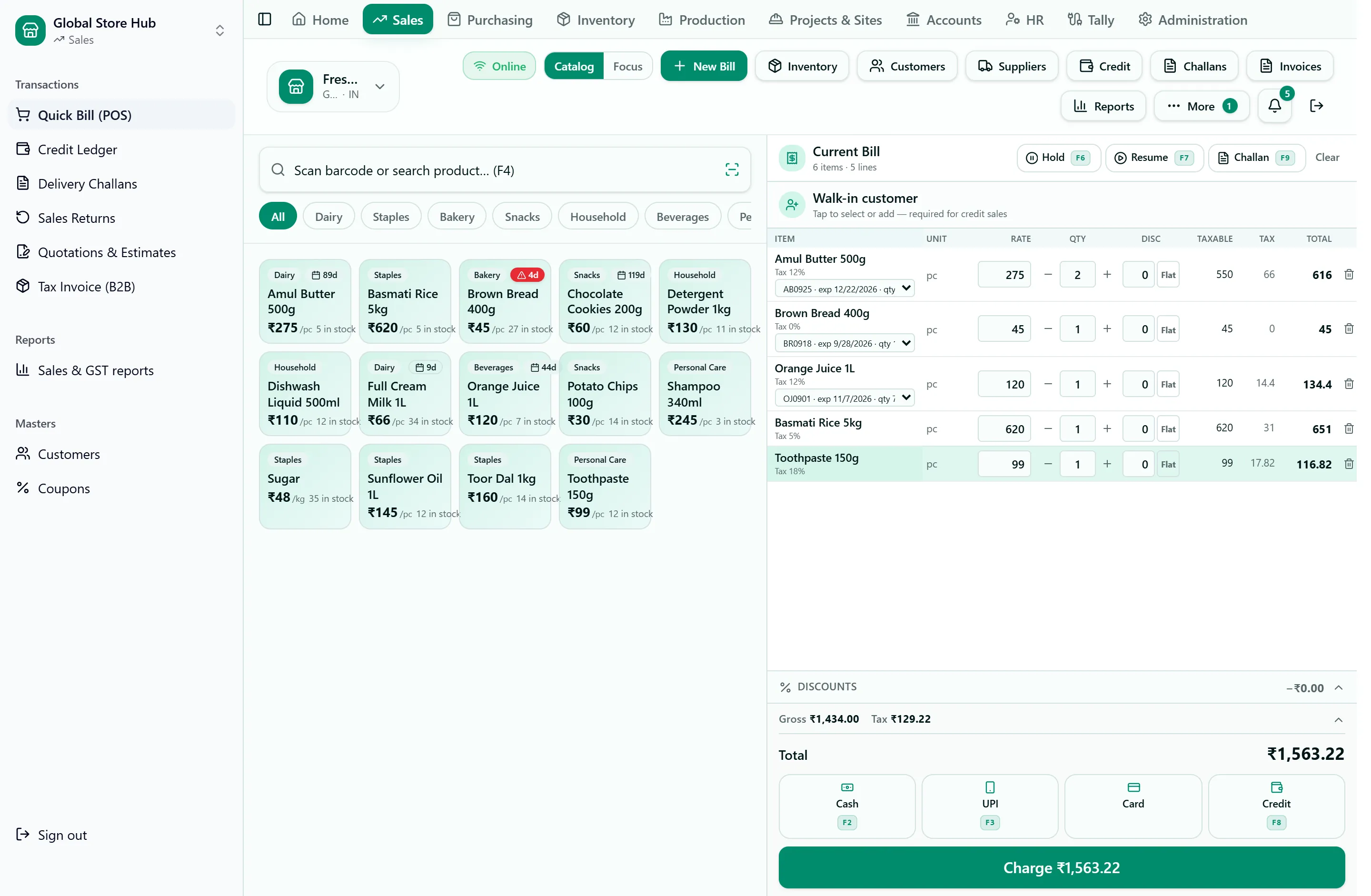 Quick Bill screen: product tiles with stock and expiry badges on the left; on the right the current bill with batch, tax and total per line, and cash, UPI, card and credit payment buttons